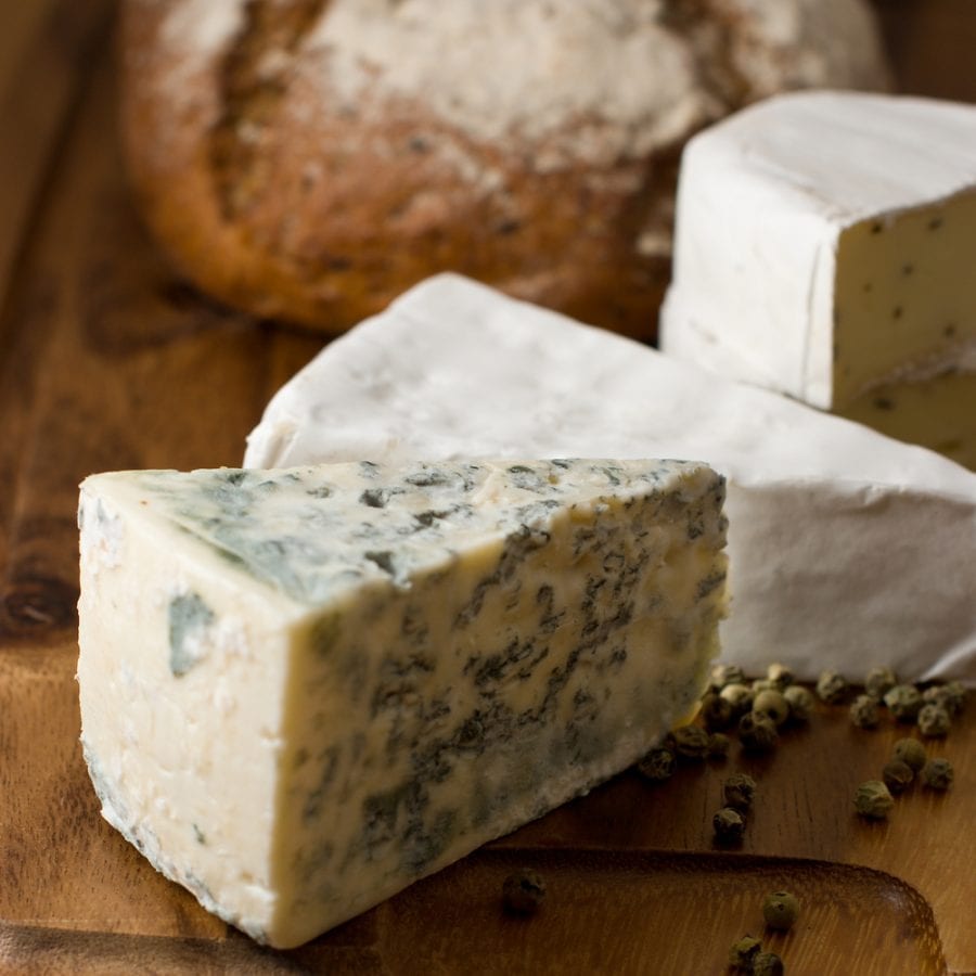 blue-cheese-with-brie-and-loaf-of-bread